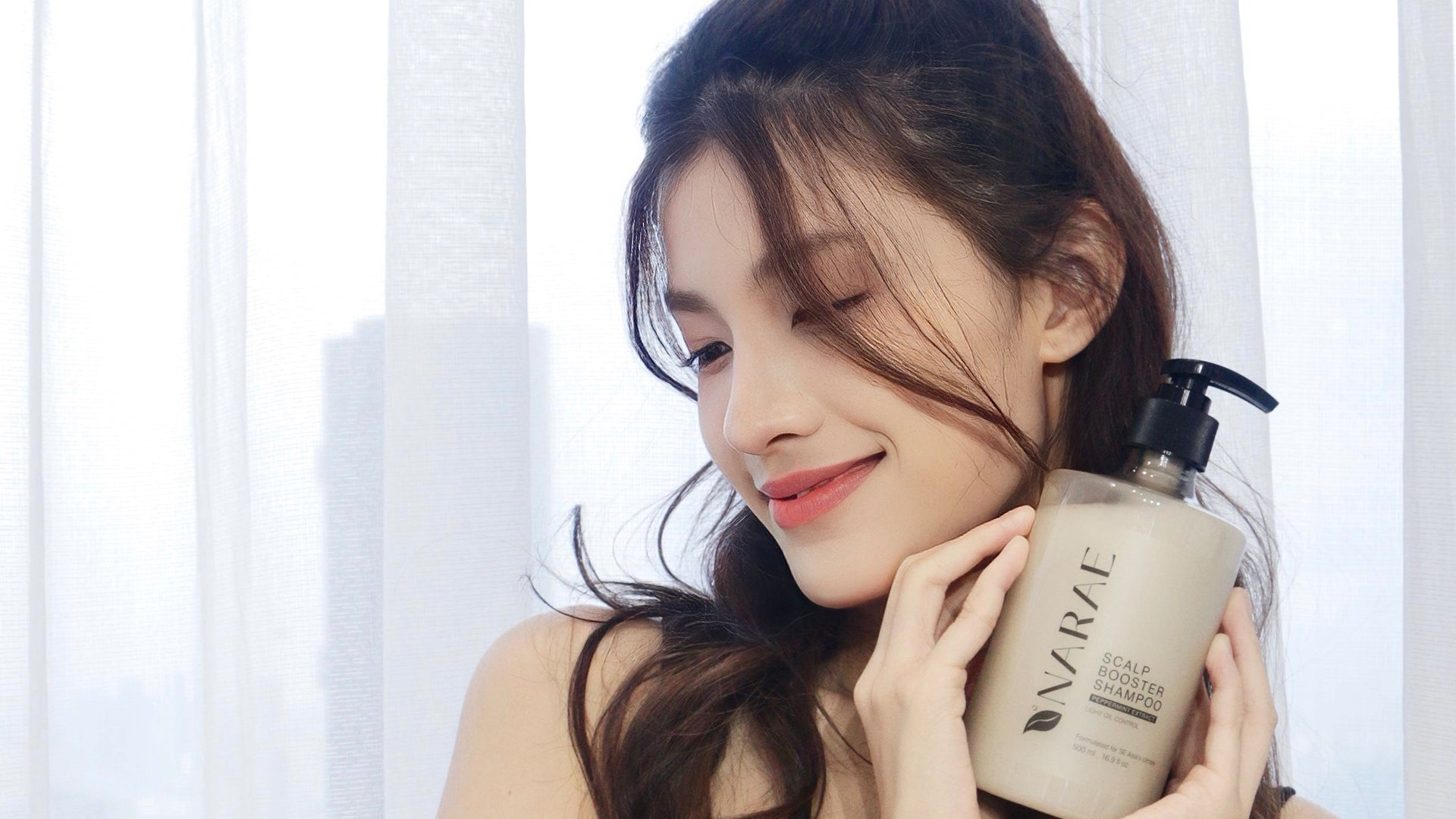 Scalp Booster Hair Shampoo bottle with peppermint extract, formulated to control oil and promote a healthy, refreshed scalp.